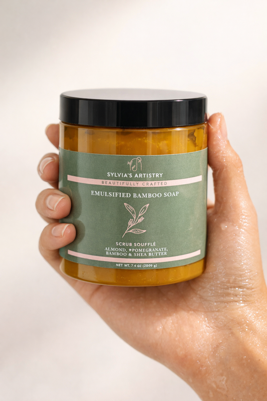 Hand holding a jar of emulsified bamboo soap with a visible brand label.